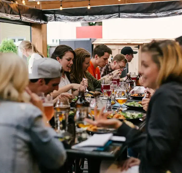 Family members gathered around tables, enjoying the high street dining experience.