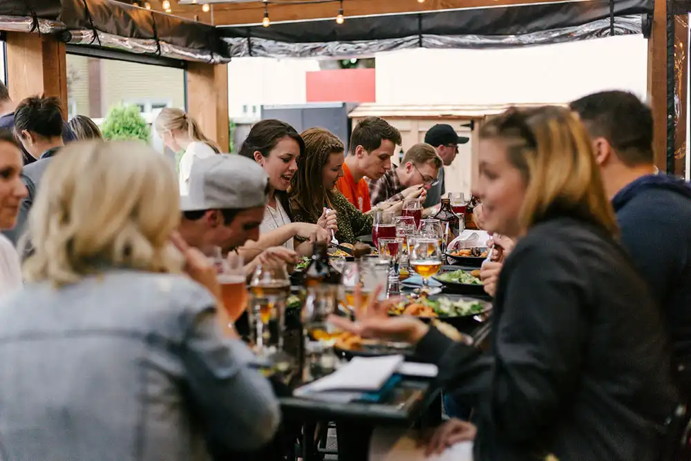 Family members gathered around tables, enjoying the high street dining experience.